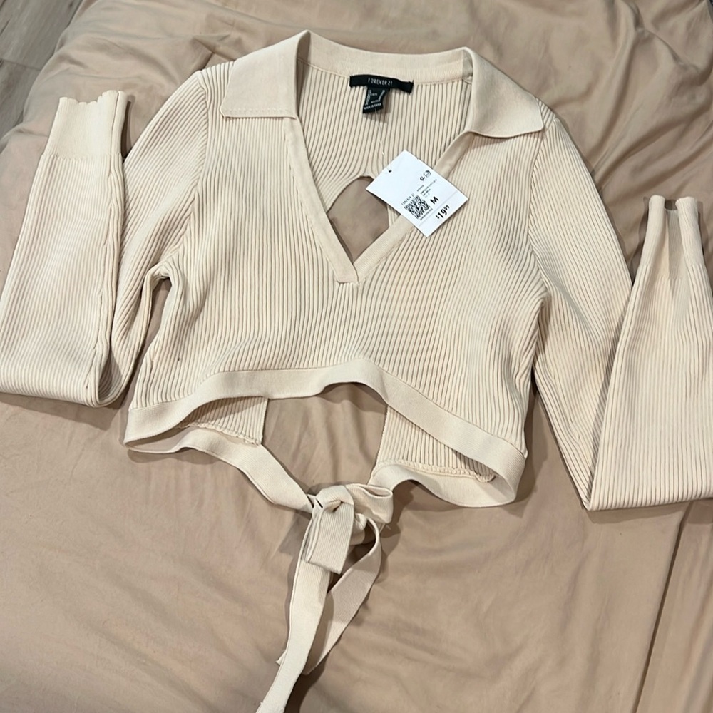 Long sleeve cropped top with collar and open back Originally $20